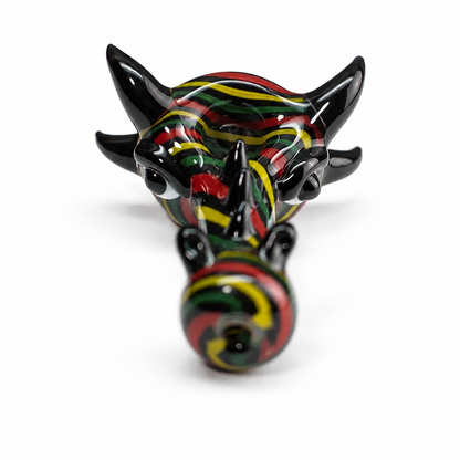 A glossy black horned figurine or decorative object with a red, yellow, and green striped pattern, photographed on a clean white background.